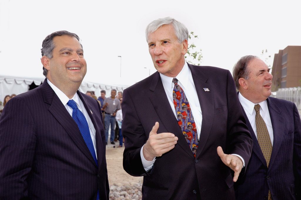 SHOWING SANDIA — Paul Robinson, center, discusses Labs work with Secretary of Energy Spencer Abraham, left and Lockheed Martin executive Mike Camardo, right. (Photo by Randy Montoya)