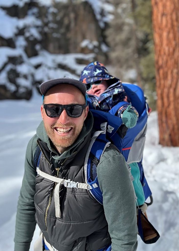 Image of Sandia chemist Andrew Knight hikes in the New Mexico mountains