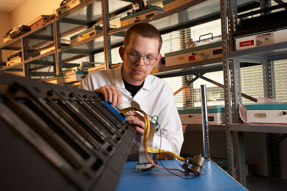 COMMUNICATING IN SPACE — An electronics technician at Compunetics tests a high-speed cable used in an aerospace application. (Photo courtesy of Compunetics)