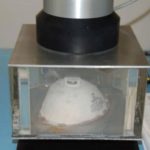 THE OLD SCHOOL WAY — N95 current testing method requires a mask to be attached to a flat surface using melted wax or putty. (Photo courtesy of the National Institute for Occupational Safety and Health)