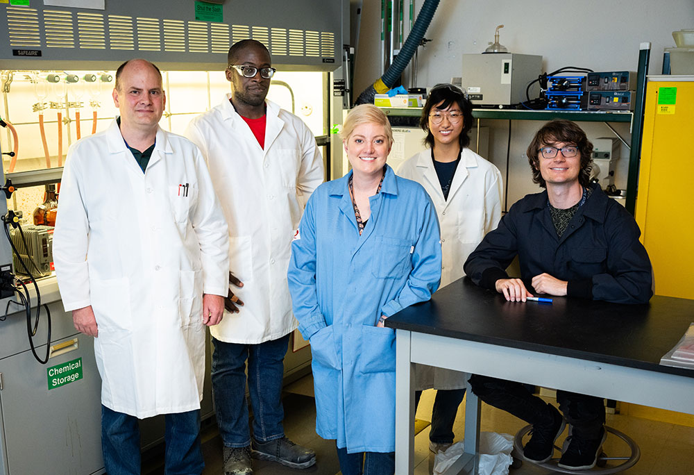 THE BRAINS BEHIND IT — From left to right, Sandia chemist Chad Staiger, technologist Kenneth Lyons, materials scientist Erica Redline, intern Alana Yoon and postdoc Eric Nagel are part of a research team helping make materials more durable. (Photo by Craig Fritz)