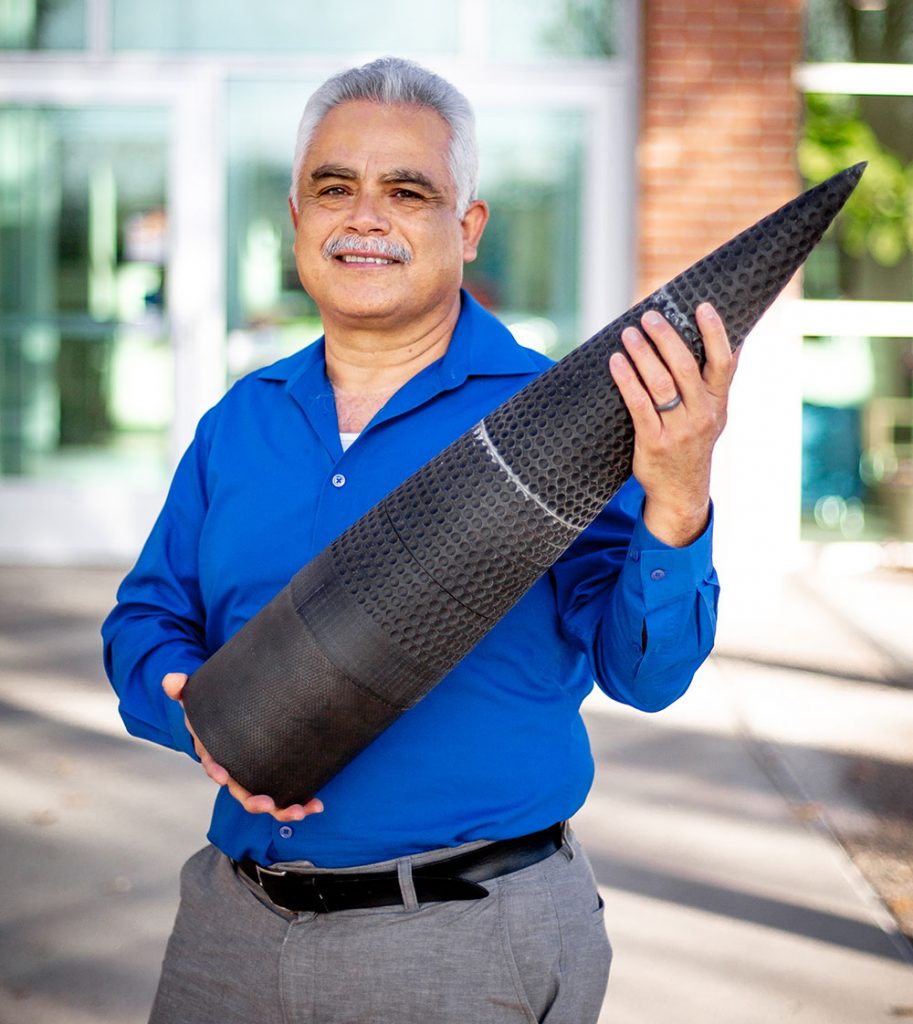 DYNAMIC ROCKET — Sal Rodriguez showing the dimpled rocket he helped create as part of a 2022 fluid dynamics project with the University of New Mexico. (Photo by Jennifer Plante)