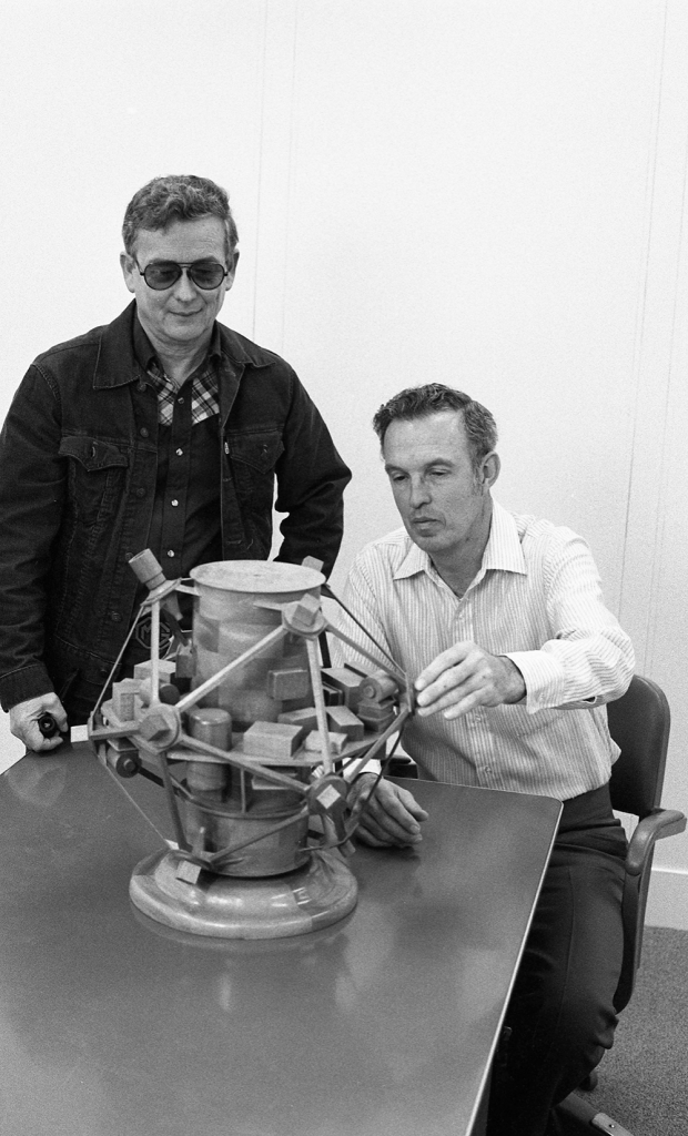 IT WILL FLY! — Bill Goldrick and John Mitchell, stalwart Vela designers, with a Vela model. (Archival Sandia photo)