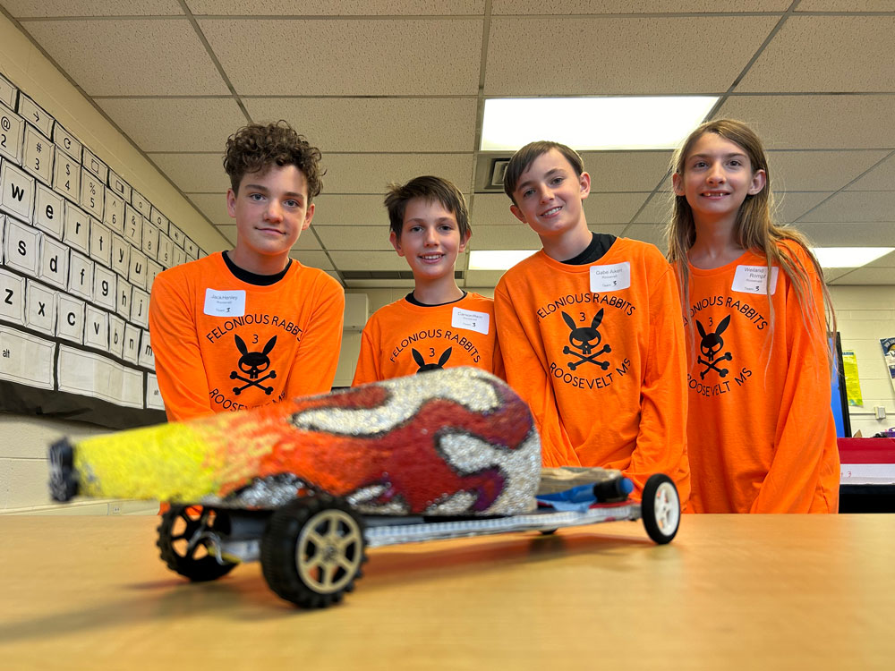 FASTEST FOURSOME — The “Felonious Rabbits” of Roosevelt Middle School created the fastest car at the 2023 NM Electric Car Challenge, which traveled 10 meters in 3.4 seconds. They credit their lightweight and aerodynamic design. (Photo by Kim Quintana)