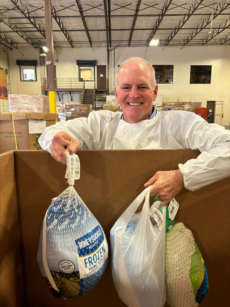 COOL DONATIONS — Information Technology Services Director Thomas Trodden unloads frozen turkeys that will be distributed in time for Thanksgiving. (Photo by Kim Vallez Quintana)