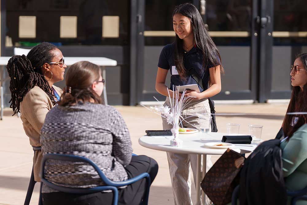 MENTORING MOMENT — Sandia mentor Karla Morris Wright, left, connects with awardee Ianna Diaz, center, from Tracy High School.