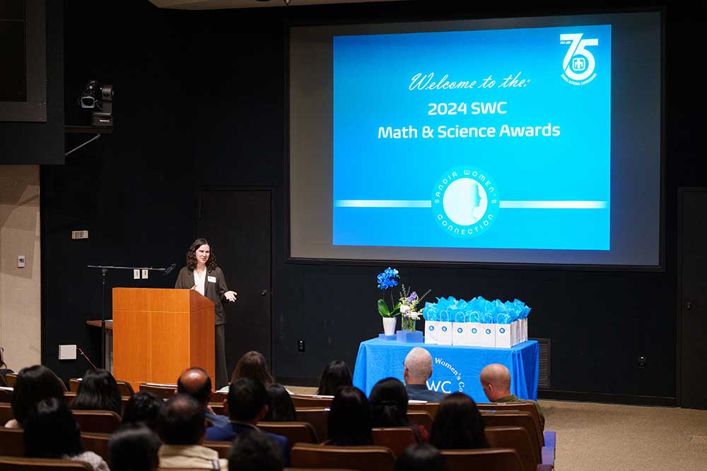 HONORING STUDENTS — Laura Losey speaks to awardees, their families and their teachers.