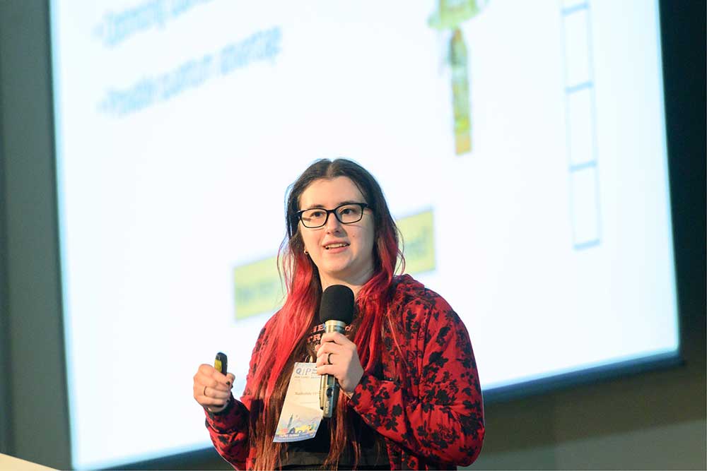 SPREADING THE NEWS — Nadezhda Voronova, a Ph.D. candidate in computer science at Boston University, presents results of her team's quantum advantage research at the Quantum Information Processing conference in Taipei, Taiwan, in January. (Photo courtesy of Quantum Information Processing 2024)