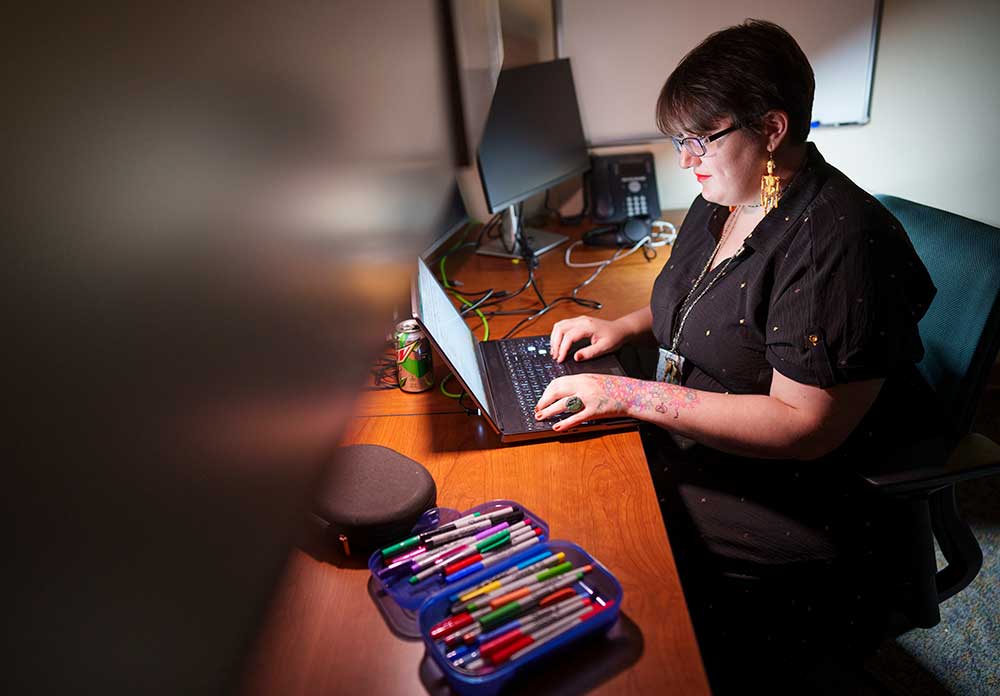 DOODLING — Amelia Henriksen, who has been diagnosed with anxiety and depression, keeps colorful pens on hand for doodling, a grounding technique she uses to help with her anxiety. (Photo by Craig Fritz)
