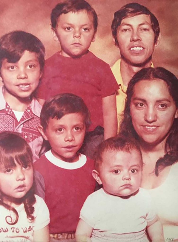 OUTNUMBERED BY THE BOYS — Del, bottom left, in a family photo from 1980 with her parents David and Marcella Tapia, and four brothers David Leon, Carl, Kenneth and Lonnie. (Photo courtesy of Del Salazar)