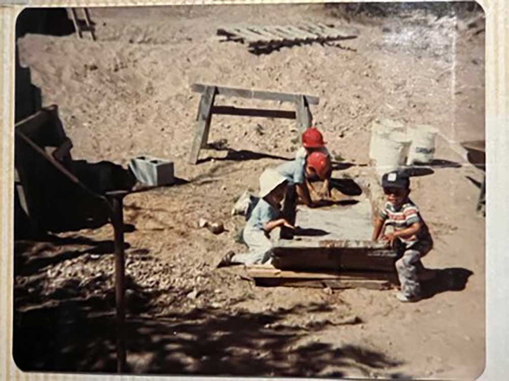 WORKING HARD AS A FAMILY — In a photo from the 1980s, Del and three of her brothers make adobe bricks to build the family home in Chupadero, New Mexico. (Photo courtesy of Del Salazar)