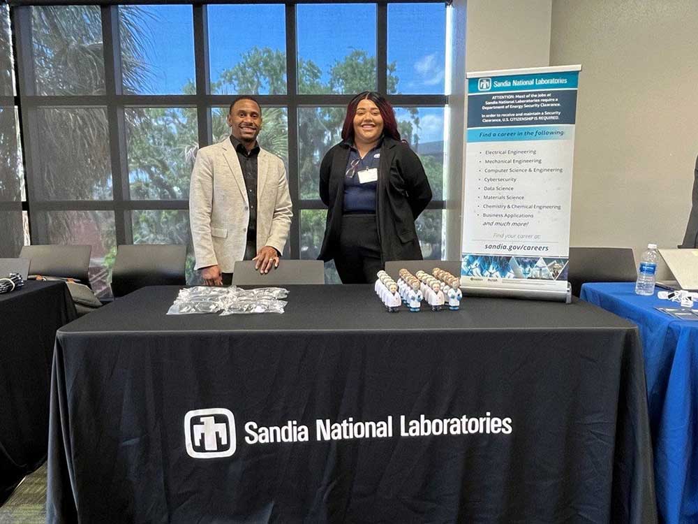 RECRUITERS — Campus Partnership Manager Anthony Sanders, left, and Technical Business Development Specialist Breanna Gallegos-Schnedar participate at the Minority Serving Institution Partnership Program annual event at Florida A&M University in April. (Photo courtesy of Anthony Sanders)