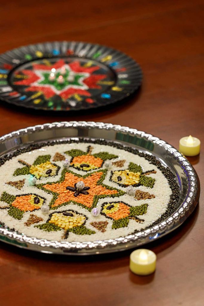 ART EXPRESSION — Rangoli — art in which patterns are created using materials including powdered limestone, colored sand and rocks, quartz powder and flower petals — were on display during Sandia California’s first Diwali celebration on Oct. 30.