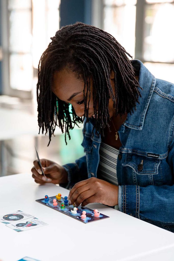 ON A (DUCK) MISSION — Emma Oti plays Abducktion during lunch. (Photo by Spencer Toy)