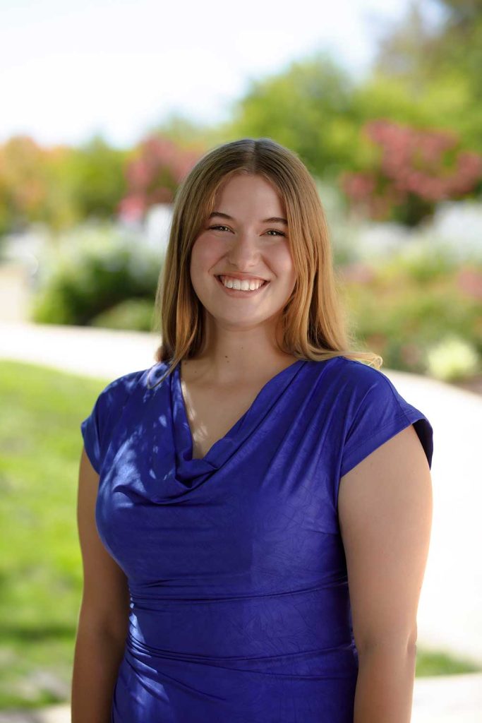 SERVICE WITH A SMILE — Community Involvement intern Amelia Harrison is a student at San Jose State University majoring in communication studies. (Photo by Spencer Toy)