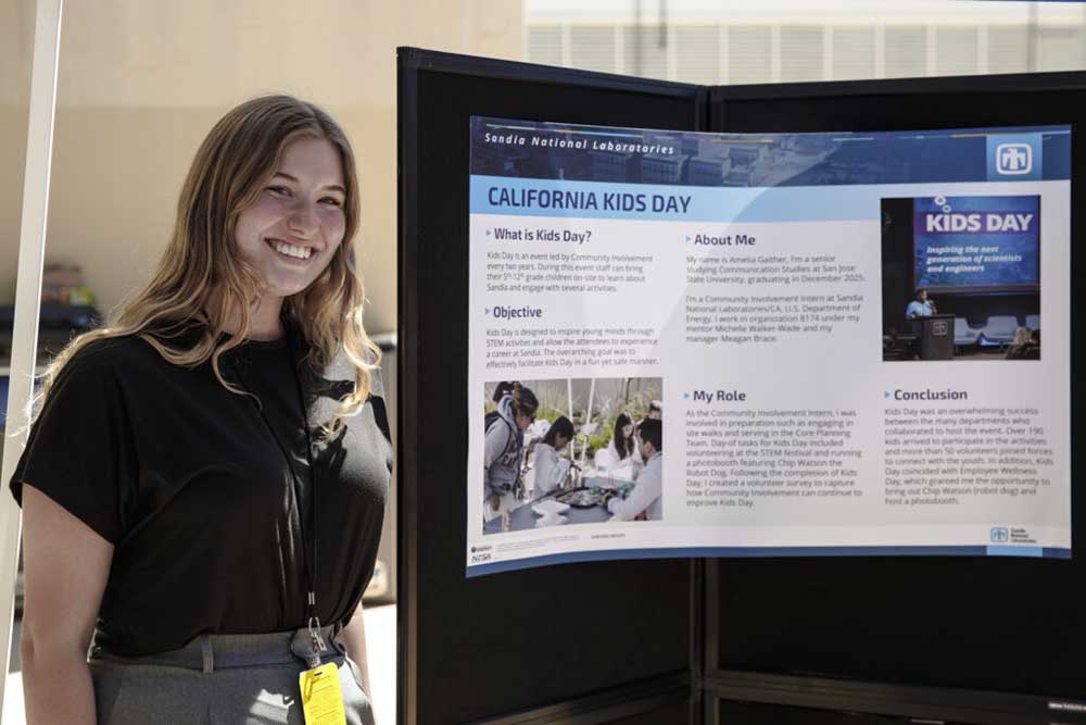 SHARING THE STORY — Amelia Harrison stands beside the poster she presented on Kids Day at the Intern Symposium. (Photo by Spencer Toy)