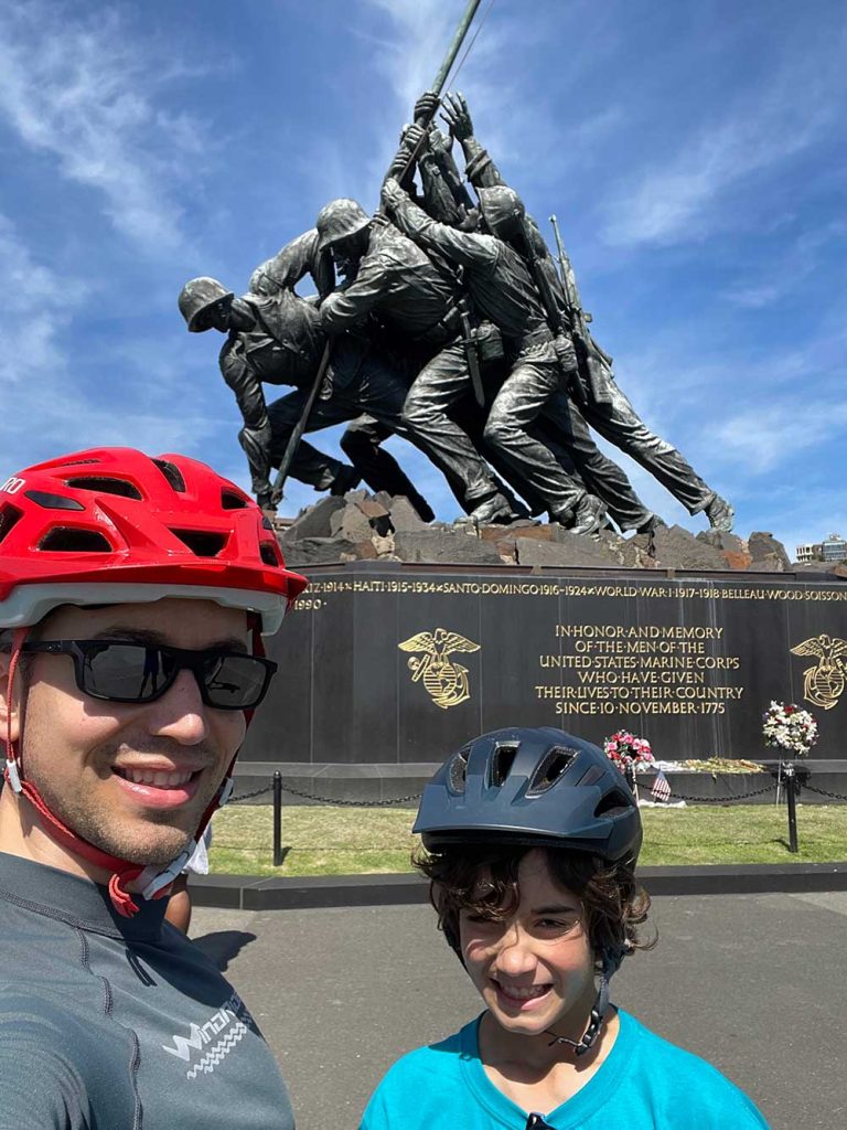 BIKE TOUR — Justin and his son visited the Marine Corps Memorial in Arlington, Virginia, during Justin’s assignment at the Pentagon. (Photo courtesy of Justin Fernandez)