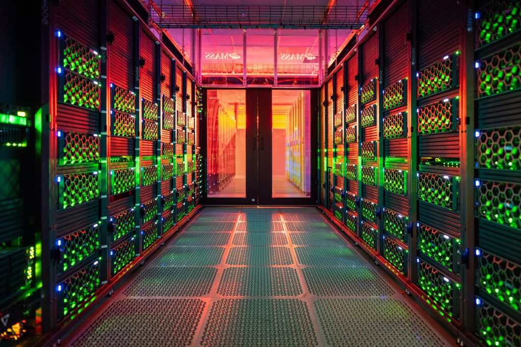 ONE JOB ON THREE SYSTEMS — Sandia's, Los Alamos' and Lawrence Livermore’s data are kept in three different places. A training run builds one model using those three different systems. Hops, pictured above, is one of the Sandia systems in the project. (Photo by Craig Fritz)