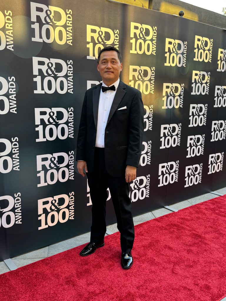 IN THE SPOTLIGHT — Hongyou Fan hits the red carpet at the R&D 100 Awards in November before accepting his honor for Researcher of the Year. (Photo courtesy of Hongyou Fan)