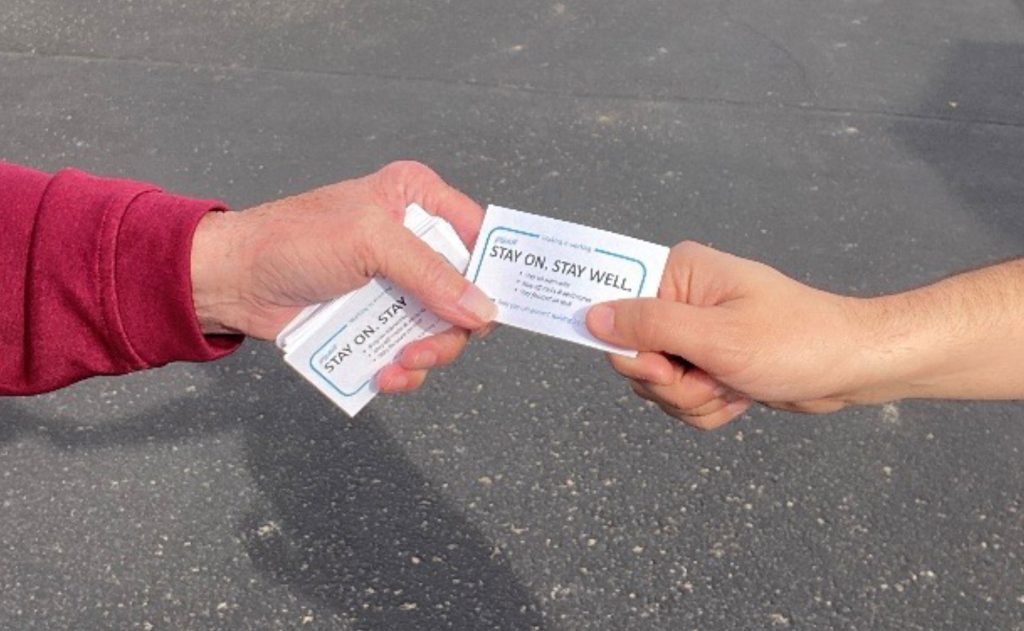 HELPFUL REMINDERS — Cards have been handed out to 3,000 employees, so far. (Photo by Lance Perry)