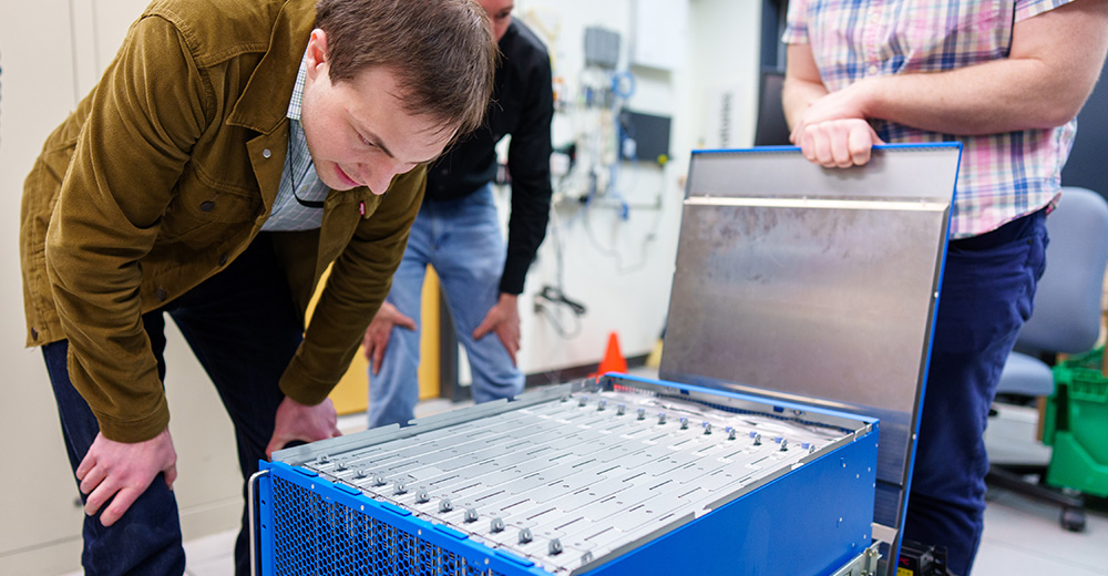 MENTAL MATH&nbsp;—&nbsp;Brad Theilman, a computational neuroscientist at Sandia, helped discover that nature-inspired, neuromorphic computers, like the one shown here, are better at solving complex math problems than previously thought.&nbsp;(Photo by Craig Fritz)
