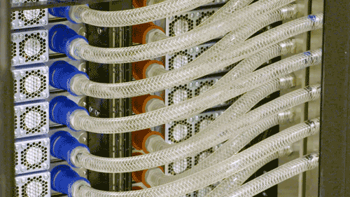 BETTER FLOW — A state-of-the-art negative pressure coolant system pulls water through Spectra to chill the Maverick-2 accelerators so Sandia researchers can test the supercomputer’s limits without worrying it will overheat. If any of these tubes are broken or disconnected, water immediately stops flowing through it, preventing accidental leaks. (Video by Arianna Andreatta and Ruth Frank)