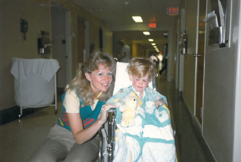 FIRST-HAND EXPERIENCE — Two-year-old Josh Parsons and his mother during his recovery from open-heart surgery. (Photo courtesy of Josh Parsons)