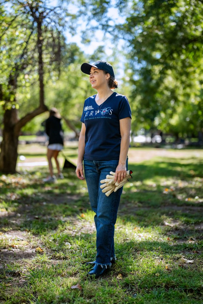 GIVING BACK — Roberta participates in Sandia Serves at the Seed2Need apple picking event in Corrales last fall. (Photo by Craig Fritz)