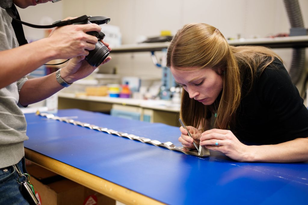<strong>UNDER INSPECTION </strong>— Electronics engineer Rebecca Schmitt, right, and mechanical engineer Simon Yang perform a destructive physical analysis of a capacitor.