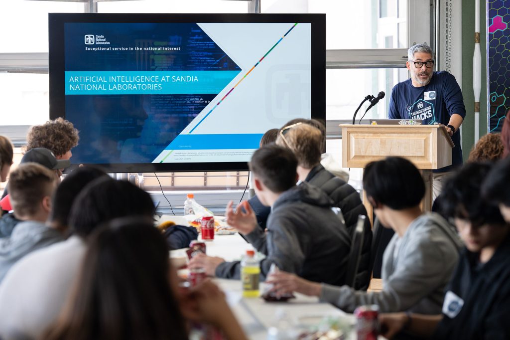 <strong>SANDIA FUTURES </strong>— Kevin Dixon, director of applied information sciences and chair of Sandia’s AI Board of Directors, presents on AI work happening at Sandia during lunch at the Thunderbird Hacks event. (Photo by David Lienemann)<br>