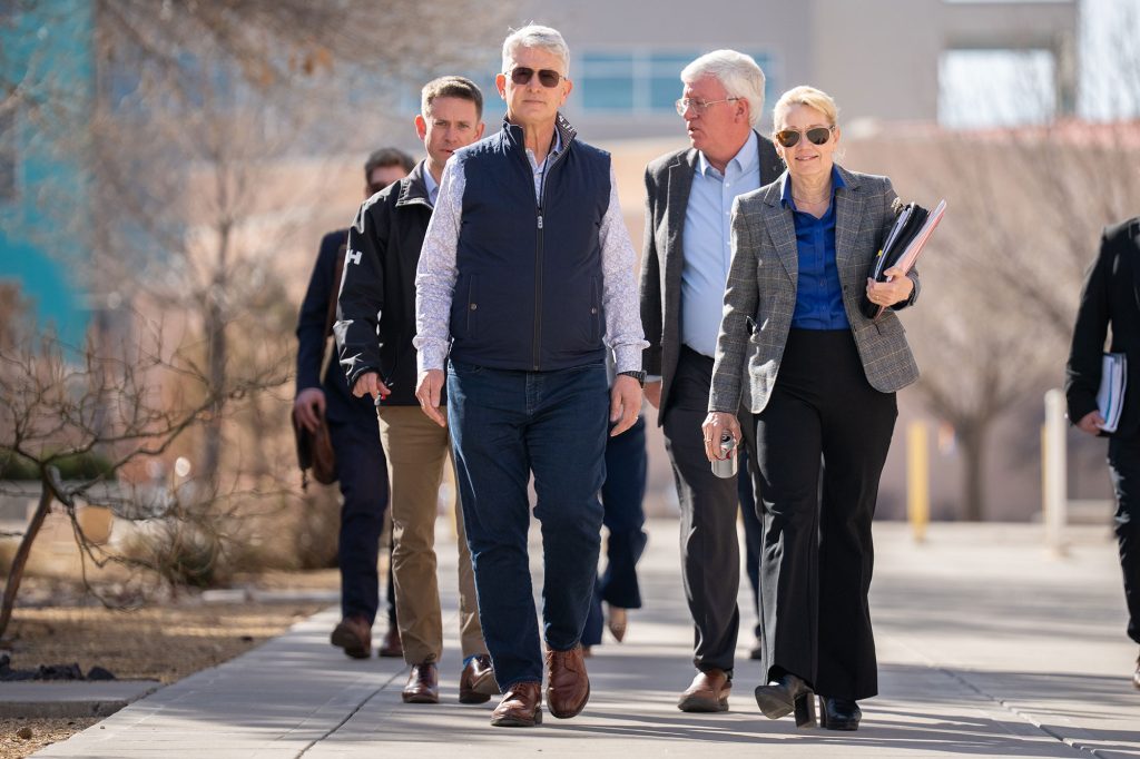 <strong>SITE WALK</strong>&nbsp;—&nbsp;NNSA Administrator Brandon Williams and Labs Director Laura McGill, front row, lead a group, including NNSA Military Assistant Kyle McVay and NNSA Sandia Field Office Manager Daryl Hauck to their next briefing during a visit.&nbsp;(Photo by Craig Fritz)<br>