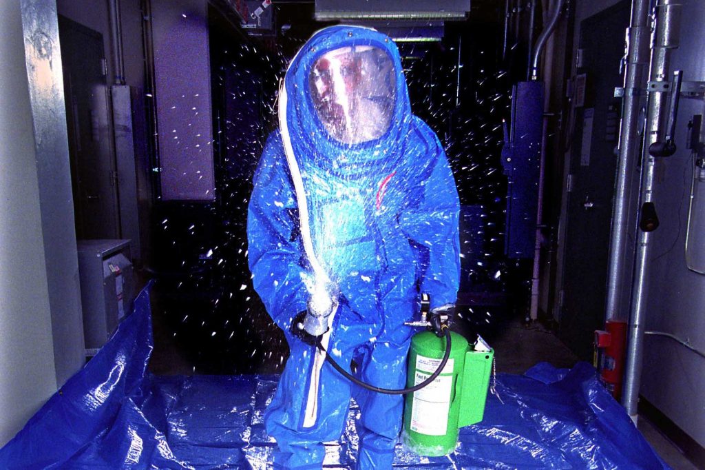 <strong>DECON FOAM</strong> — In a 1999 photo, foam co-developer Maher Tadros demonstrates application of the product from a pressurized canister. (Photo by Randy Montoya)