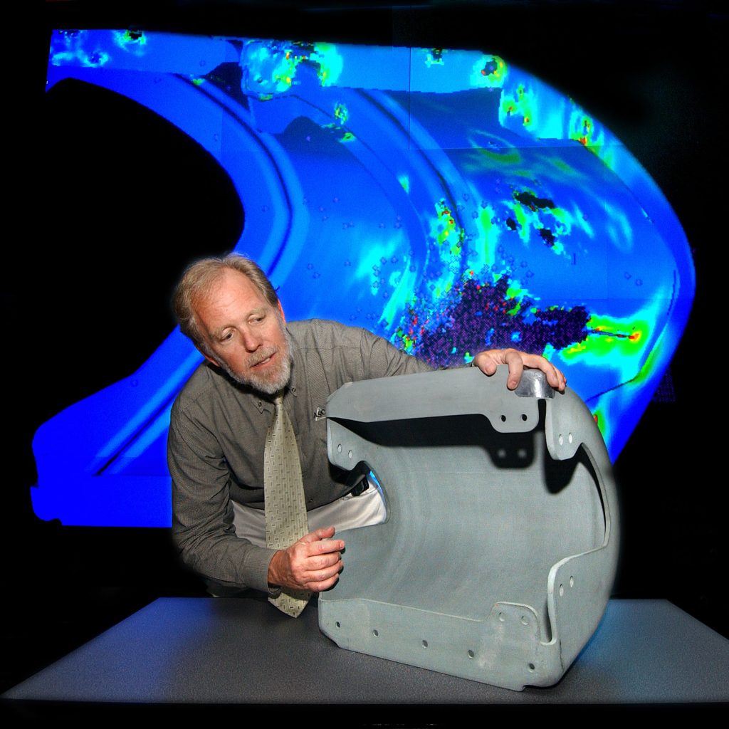 <strong>A CLOSER LOOK</strong> — Former Sandia Engineering Sciences Director Tom Bickel checks out the leading edge of a space shuttle wing in a Lab News photo from 2003. (Photo by Randy Montoya)
