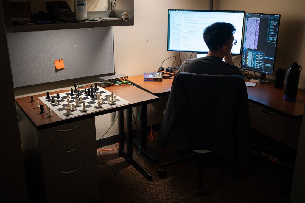 <strong>PAWN TO D4</strong> — Sandia cybersecurity expert Kinsleigh Wong keeps a chess board in his office when he needs to take mental break. Kinsleigh, a past resident, now serves as a mentor for Sandia’s cyber residency program. (Photo by Craig Fritz)