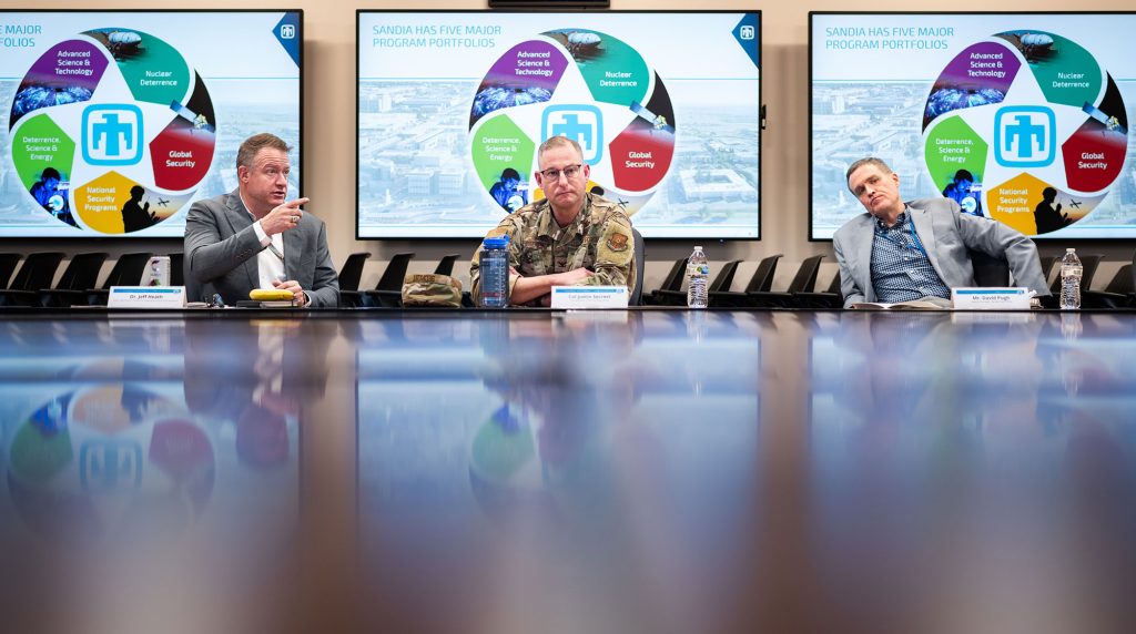 <strong>NEIGHBOR BRIEFING</strong> — From left, Associate Labs Director Jeff Heath briefs Col. Justin Secrest, commander of the 377th Air Base Wing Kirtland Air Force Base, and NNSA Sandia Field Office Deputy Manager David Pugh, during a tour of the Labs on Feb. 27. They toured facilities such as the Emergency Operations Center, Z machine, the Neutron Generator Enterprise and the Weapons Display Area. They also received briefings on hypersonics, the Center for Advanced Manufacturing and Innovations and more. (Photo by Craig Fritz)