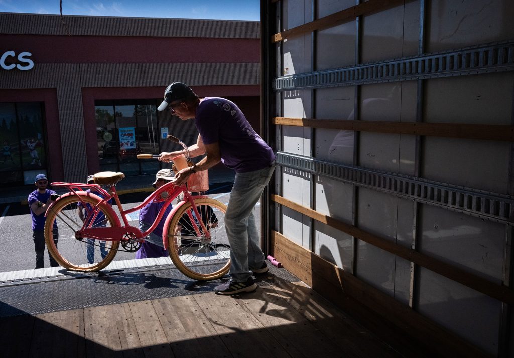 <strong>TUNE UP</strong> — Clay Campbell with Free Bikes 4 Kidz New Mexico loads a bike into a box truck at the Trek Store on April 4. The organization collected 48 bikes at the event. Sandia volunteers assisted with cleaning and refurbishing them for donation to local partners such as afterschool programs, health clinics, church groups, crisis centers and tribal organizations. (Photo by Craig Fritz)