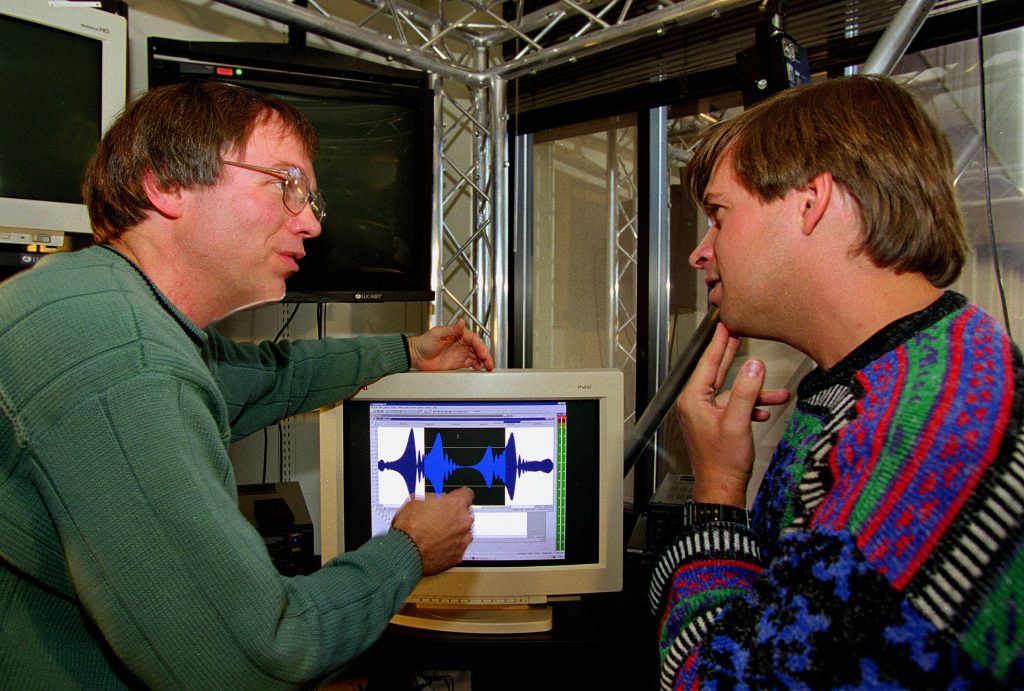 <strong>SOUND SCIENCE</strong> — Sandia computer scientist Carl Diegert, left, and New Mexico Museum of Natural History and Science paleontologist Tom Williamson confer at the computer as they put the finishing touches on the dinosaur sound. (Photo by Randy Montoya)