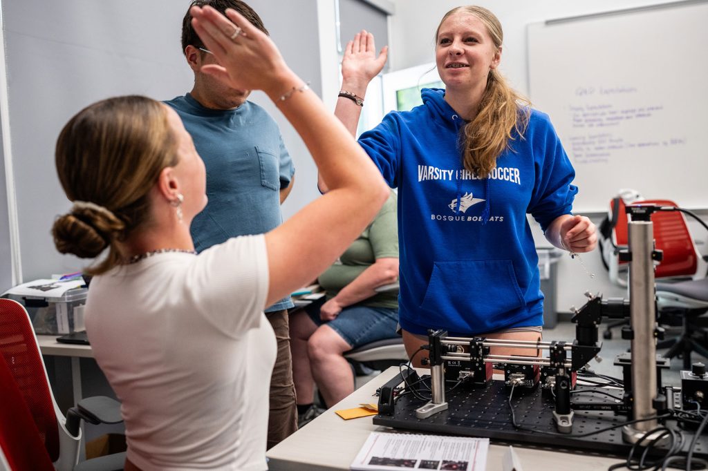 <strong>HIGH-FIVE TO QUANTUM</strong> — Students learn the basics of quantum physics and its impact on computing at QCamp 2025, a camp founded by Sandia’s Megan Ivory and Jake Douglass. (Photo by Craig Fritz)