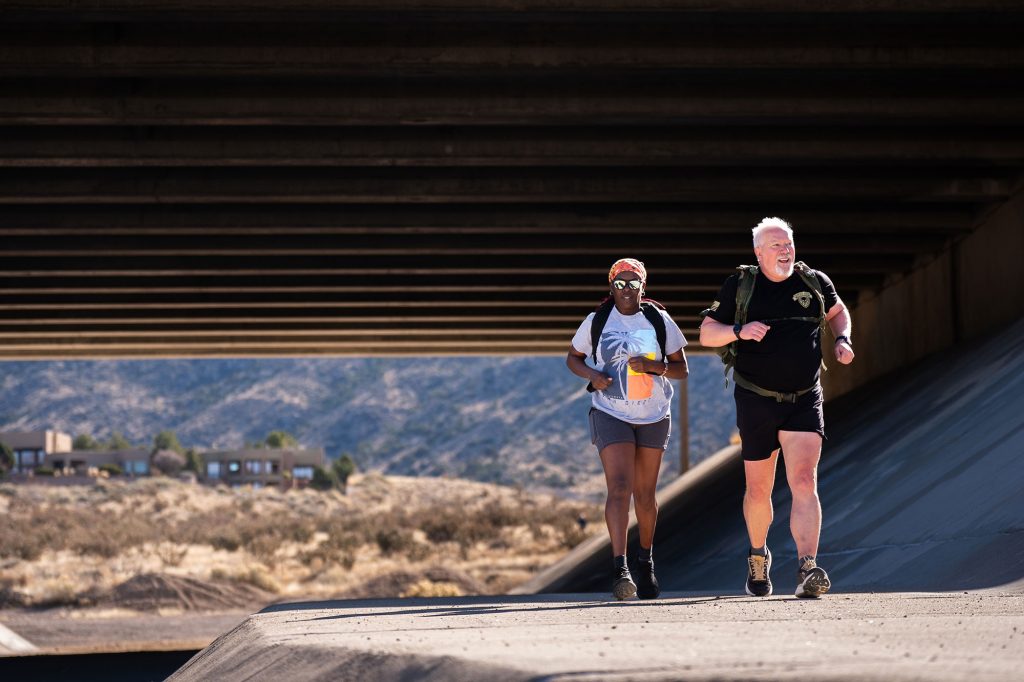 <strong>THE ‘REGULAR DUDE’ </strong>— While Don Gillich, pictured with girlfriend Eva Lagat, has run 59 marathons, one in each U.S. state, he said he’s just a regular dude with a knack for sticking to his goals. (Photo by Craig Fritz)