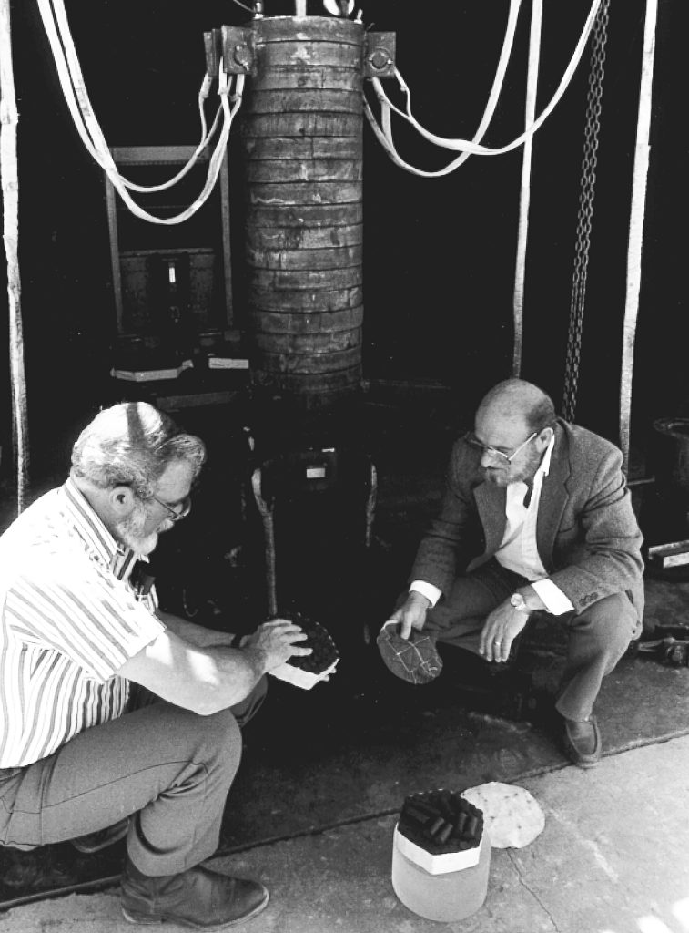 <strong>DROP TEST</strong> — Karl Schuler, left, and Paul Cooper examine the drop test setup for their investigation of the 1989 explosion aboard the USS Iowa. (Photo from the Sandia archives)