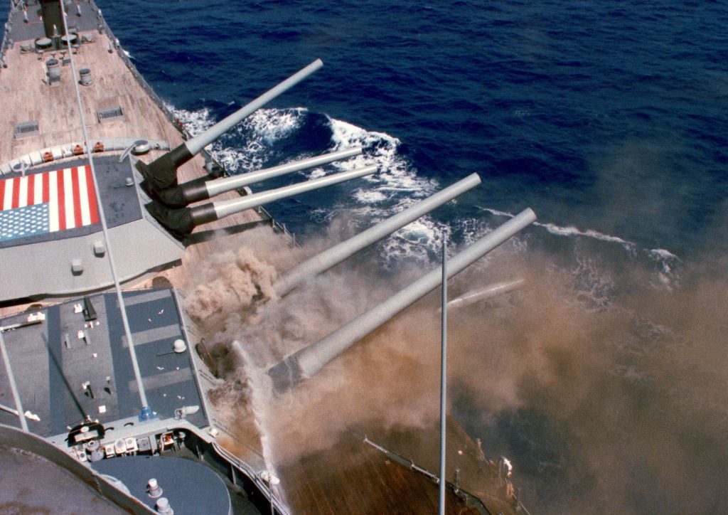 <strong>DEADLY EXPLOSION</strong> — Iowa's number two turret is cooled with sea water shortly after exploding. The explosion killed 47 sailors aboard the battleship. (Photo by the U.S. Navy)