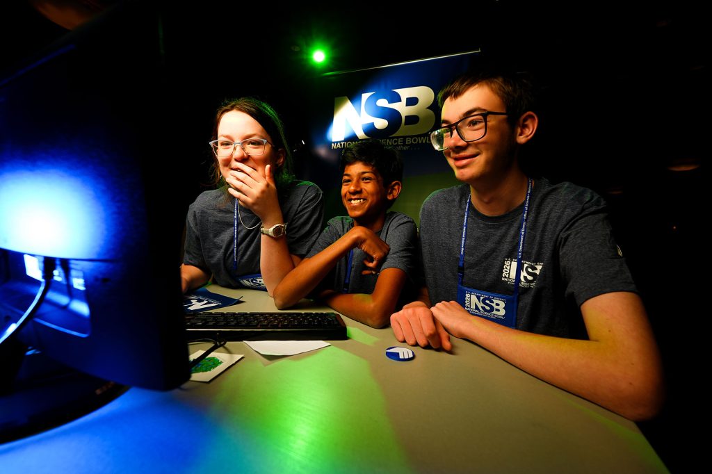 <strong>CYBER MATCH </strong>— From left, Los Alamos Middle School team members Norah Whitton, Muhil Sasikumar and Evan Cunningham compete in the cyber challenge at the DOE National Science Bowl on May 3. (Photo by Jack Dempsey, DOE Office of Science)