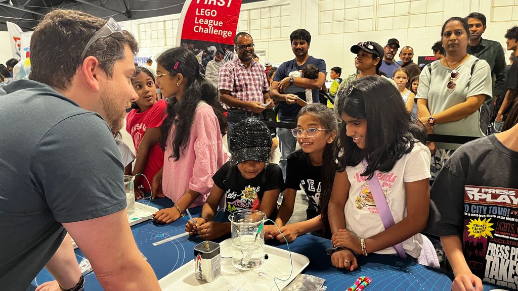 <strong>INNOVATION INQUIRIES </strong>— Liam Taylor engages attendees during the hydrogen activity. (Photo by Michelle Walker-Wade)