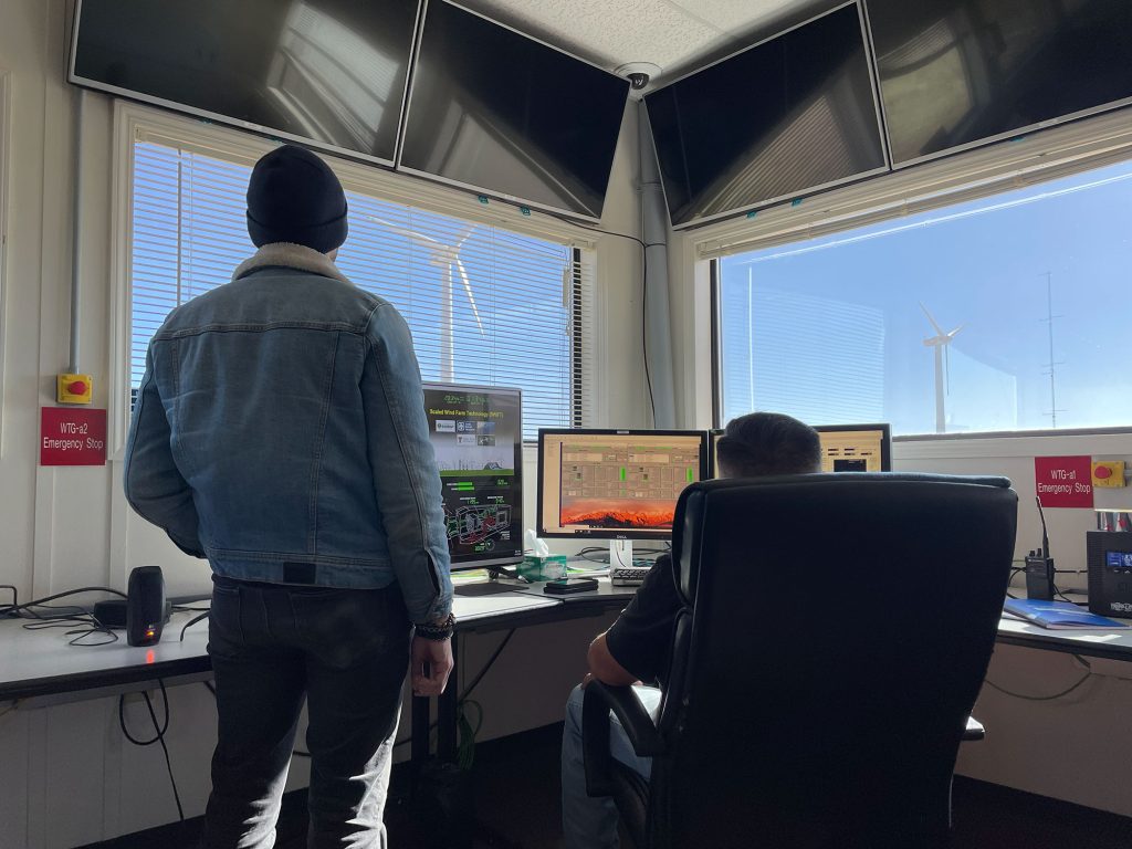 <strong>GRID CONTROL</strong> — Sandia researchers Rachid Darbali-Zamora and Miguel Jimenez-Aparicio tested AI controls on a microgrid at Texas Tech University. The test demonstrated the system’s ability to manage energy flows in real time. (Photo by Sandia)