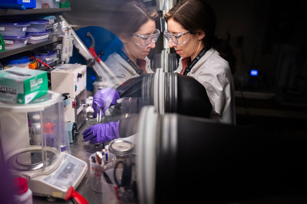 <strong>IN THE HOOD </strong>— Sandia electrochemist Aliya Lapp prepares a sample of upcycled lithium battery cathode for testing. (Photo by Craig Fritz)