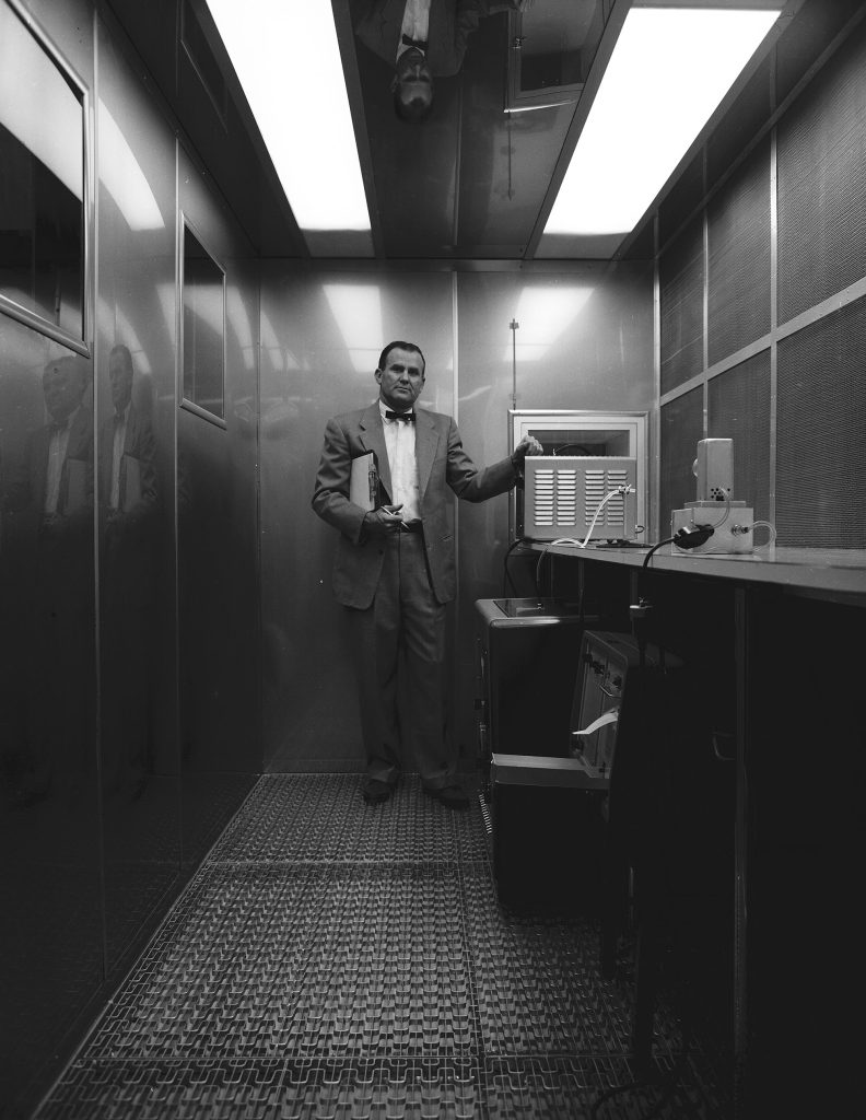 <strong>MR. CLEAN</strong> — In a 1962 photo, Willis Whitfield stands inside the laminar flow clean room he invented. (Photo from the Sandia archives)