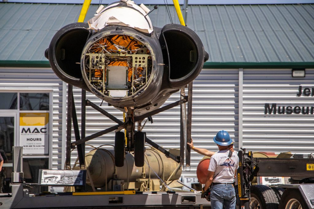 <strong>EASY, EASY</strong>&nbsp;—&nbsp;An aircraft engineer from Worldwide Aircraft Recovery monitors as the U-2 plane is lifted into the air via crane during the May 22 unloading in Albuquerque.&nbsp;(Photo by Lyndsee Cantly, National Museum of Nuclear Science & History)