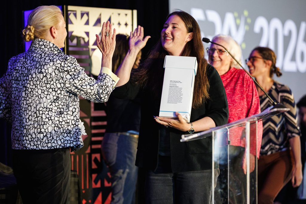 <strong>HIGH-FIVE</strong> — The W80-4 Warhead Case Anomaly Resolution Team earned a public congratulations from Labs Director Laura McGill during a May 28 event in Livermore for the work that earned them an Employee Recognition Award and Labs Director’s Award. (Photo by Spencer Toy)