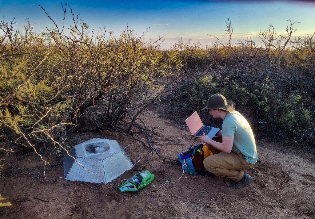 <strong>DATA READINGS</strong> — Year-round intern Logan Scamfer checks data recorded by a ground sensor in Alaska. (Photo courtesy of Logan Scamfer)