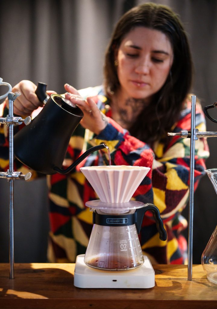 <strong>PERFECT BREW</strong> — Kate Sweeney pours coffee at the Michael Thomas Coffee shop in Albuquerque. Michael Thomas Coffee collaborated with Sandia to outfit its existing roaster with a device to use stored solar energy to roast coffee beans.&nbsp;